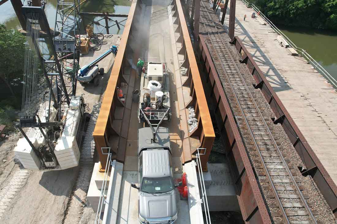 Highway bridge deck preparation and surface treatment before waterproof membrane application