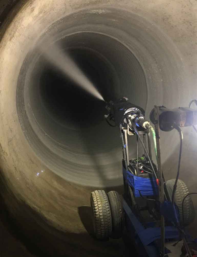 SIPP robotic equipment in action applying polyurea coating technology inside pipe infrastructure
